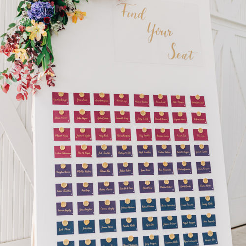 Jewel Toned Escort Card Wall with Gold Calligraphy and Wax Seals at Hangar 9 by CalliRosa