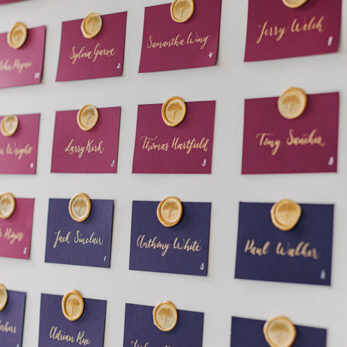 Jewel Toned Escort Cards with Gold Calligraphy and Wax Seal at Hangar 9 by CalliRosa