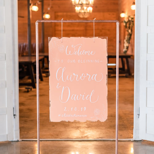 Peach Colored Welcome Sign with Floral Line Drawing on Copper Stand in San Antonio by CalliRosa