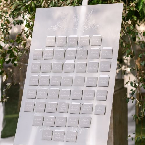 Frosted White and Grey Seating Chart Installation With Custom Pockets and Calligraphy for Austin Wedding by CalliRosa Texas Calligrapher