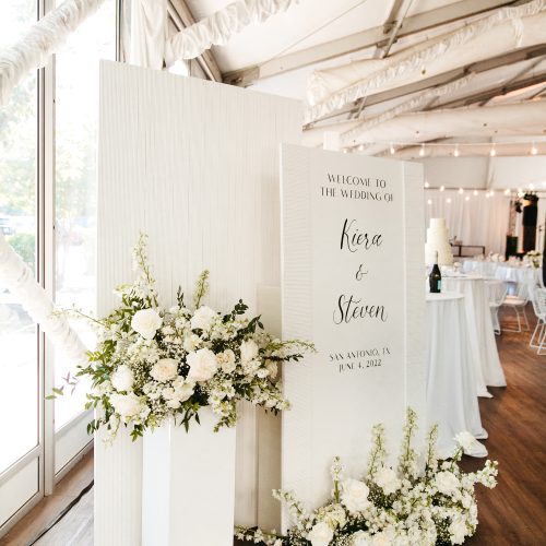 White Textured Welcome Sign Installation with Black Calligraphy for Modern Wedding by CalliRosa Austin Calligrapher